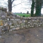 Reclaimed stone wall entrance with stanners.